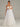 Strapless Tulle Wedding Dress With Feathered And Mirror Trim