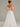 Strapless Tulle Wedding Dress With Feathered And Mirror Trim