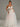 Strapless Tulle Wedding Dress With Feathered And Mirror Trim